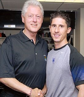 Jeff Cavaliere with Bill Gates at a professional event, demonstrating his expertise beyond fitness training