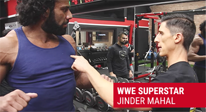 Professional wrestler Jinder Mahal demonstrating strength training techniques with Jeff Cavaliere
